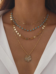 Gold-Tone Layered Necklace with Beads and Disc Pendant