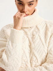 Fringe Hem Cable-Knit Turtleneck Sweater